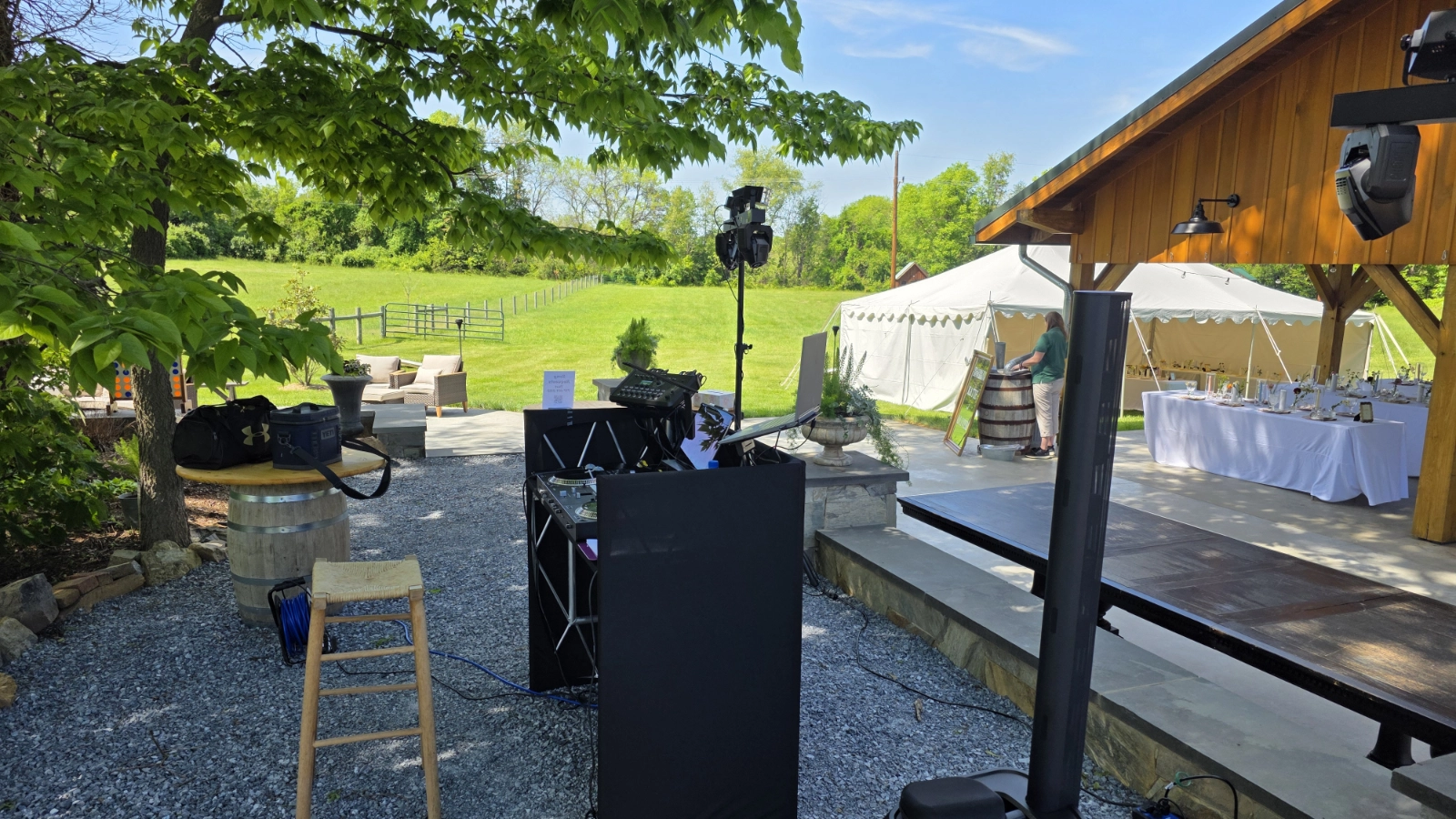 DJ Sideout production equipment positioned across an outdoor event site with multiple guest areas.