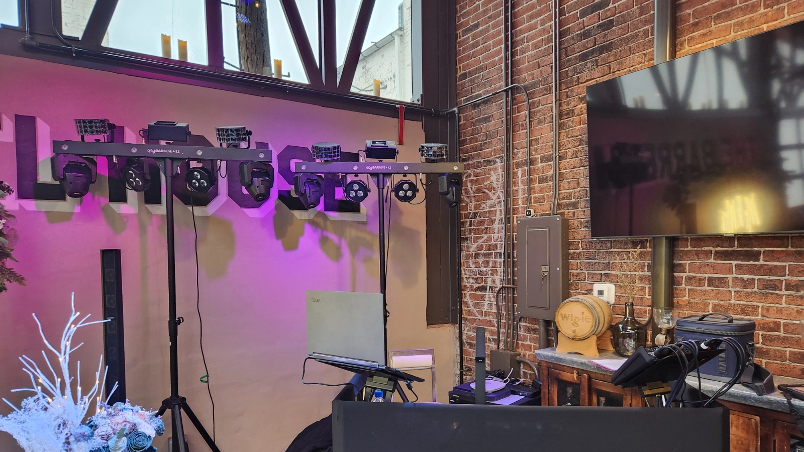 DJ Sideout lighting and production equipment arranged inside a winery event space.